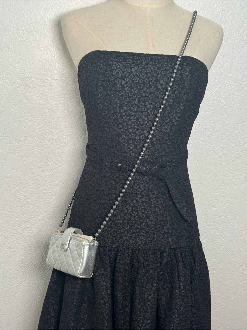 CHANEL Silver Quilted Leather O-Phone Holder with Pearl Chain.